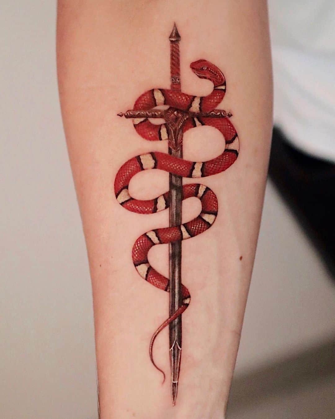 snake and dagger tattoos